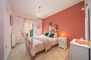a bedroom with a bed and a large window at stunning tranquil villa with private pool in Sami
