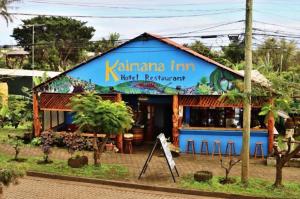 a blue building with a sign in front of it at Kaimana Inn Rapa Nui in Hanga Roa