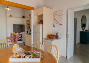 a kitchen with a table with a box of food on it at Komis Mansion Exambela in Exámbela