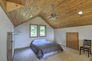 a bedroom with a bed and a wooden ceiling at Idyllic Retreat about 20 Mi to Olympic National Park! in Port Angeles