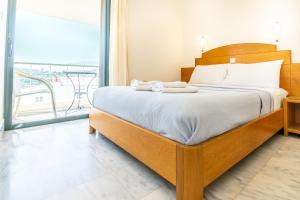 Ένα ή περισσότερα κρεβάτια σε δωμάτιο στο Orestis Hotel Sea View Apartments