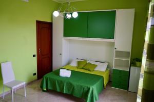 A bed or beds in a room at B&B Milena