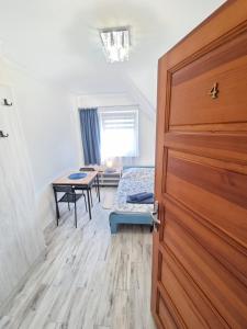 Posteľ alebo postele v izbe v ubytovaní Gościniec Joanna