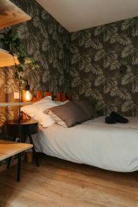 Giường trong phòng chung tại La DOLCE Villetta - appartement de Standing