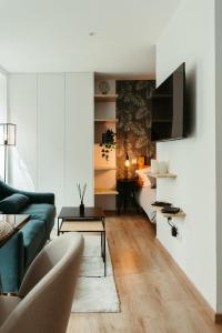 a living room with a couch and a table at La DOLCE Villetta - appartement de Standing in Mulhouse