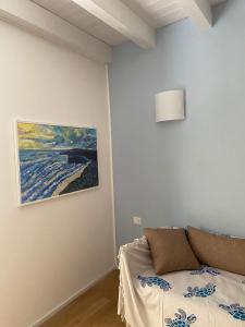 Postel nebo postele na pokoji v ubytování Le Vele Carloforte