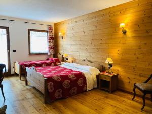 Voodi või voodid majutusasutuse Hotel L'Artisin toas