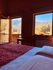 Voodi või voodid majutusasutuse Hotel L'Artisin toas