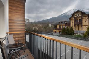 a balcony with a view of a mountain at Tatry Apartman, PRIMO, Starý Smokovec, Vysoké Tatry in Starý Smokovec
