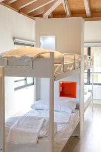 a couple of bunk beds in a room at ATERPE KANPEZU HOSTEL in Santa Cruz de Campezo