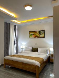 Кровать или кровати в номере IKAZE APARTMENTS