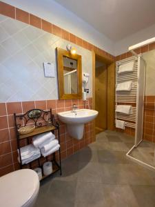 Vannituba majutusasutuses Hotel L'Artisin