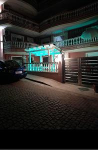 a car parked in front of a building at night at petros house in Sarti