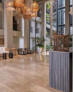 a lobby with a large room with chandeliers at Madisson Boutique Hotel Cartagena in Cartagena de Indias