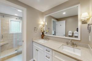 a bathroom with two sinks and a large mirror at 366 Ghia Farm Road in Ludlow +55 photos