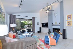 a living room with a couch and a fireplace at Sundance Villa Condo E Permit# 2845 in Palm Springs
