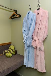 three towels are hanging on a wall at Kepler Mountain View in Manapouri
