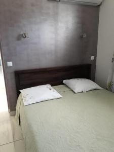 Postel nebo postele na pokoji v ubytování JONA APT + 2 fotografie