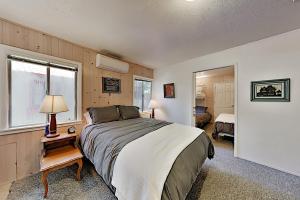 a bedroom with a large bed and a window at Villa Eileen in Guerneville