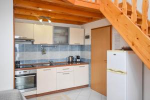 Kuchyň nebo kuchyňský kout v ubytování Apartments Studenac