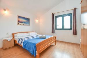 Postel nebo postele na pokoji v ubytování Apartments Studenac