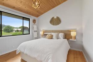 Postel nebo postele na pokoji v ubytování Shell Shack - BYO Linen