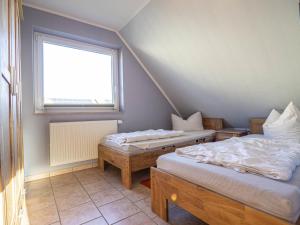 Ένα ή περισσότερα κρεβάτια σε δωμάτιο στο Ferienhaus Karola, Wohnung 2 - OG