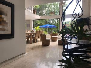 Zahrada ubytování HERMOSA CASAQUINTA FAMILIAR CONDOMINIO CAMPESTRE EL PEÑON Piscina Privada Campo de Golf