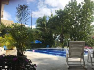 Bazén v ubytování HERMOSA CASAQUINTA FAMILIAR CONDOMINIO CAMPESTRE EL PEÑON Piscina Privada Campo de Golf nebo v jeho okolí
