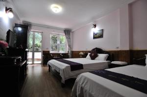 Postel nebo postele na pokoji v ubytování Ngan Nga Bac Ha Hotel + 37 fotografií