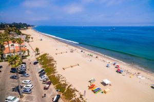 an overhead view of a beach with people and the ocean at Santa Cruz in Santa Barbara
