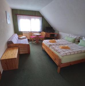 Postel nebo postele na pokoji v ubytování Hotel Restaurant Baumhaus