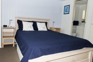 A bed or beds in a room at Ocean Break - at Berrara
