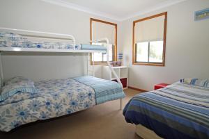 A bunk bed or bunk beds in a room at Perfect family holiday