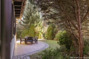 Zahrada ubytování SILVA Guest House - dom wczasowy, tenis, basen, balia i sauna