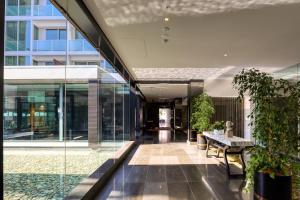 an empty lobby of a building with glass walls at Marsden Viaduct Hotel in Auckland