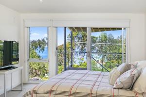 Ένα ή περισσότερα κρεβάτια σε δωμάτιο στο Sunhaven