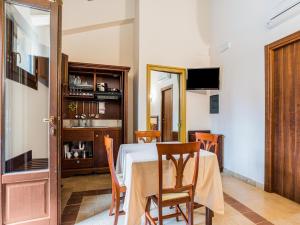 a dining room with a table and chairs at Inviting Holiday Home in Carlentini with Pool in Carlentini