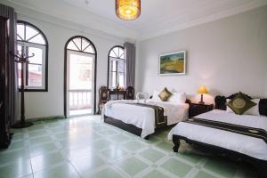 Postel nebo postele na pokoji v ubytování Joye Hotel + 37 fotografií