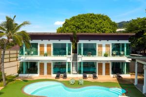 an aerial view of a house with a swimming pool at 4U Resort Samui in Lamai