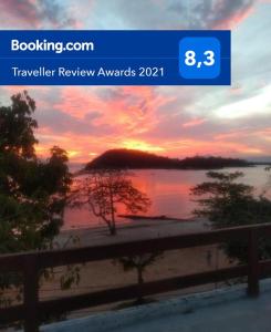 a picture of a sunset over a body of water at Suites Moreninha in Rio de Janeiro