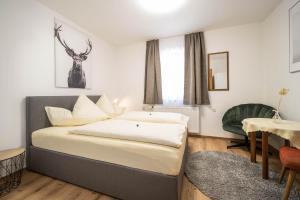 Postel nebo postele na pokoji v ubytování Haus Kindler