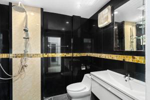 a bathroom with a toilet and a sink and a shower at 4U Resort Samui in Lamai