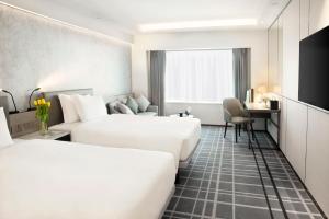 Voodi või voodid majutusasutuse Royal Park Hotel toas