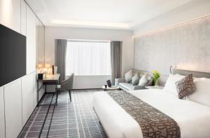 Voodi või voodid majutusasutuse Royal Park Hotel toas