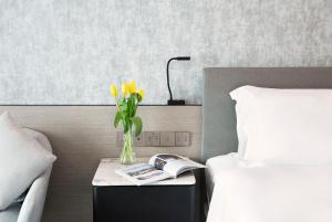 Voodi või voodid majutusasutuse Royal Park Hotel toas