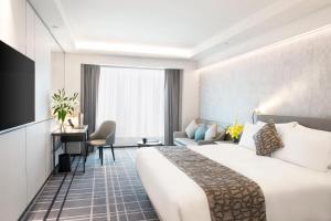 Voodi või voodid majutusasutuse Royal Park Hotel toas