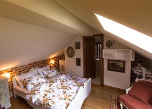 a bedroom with a large bed in a attic at Palazzo Drusko Deluxe Rooms in Kotor