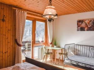 a bedroom with a bed and a table and a window at Gasthaus Jägerhaus in Fridingen an der Donau