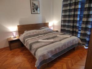 Postel nebo postele na pokoji v ubytování Apartman Ana